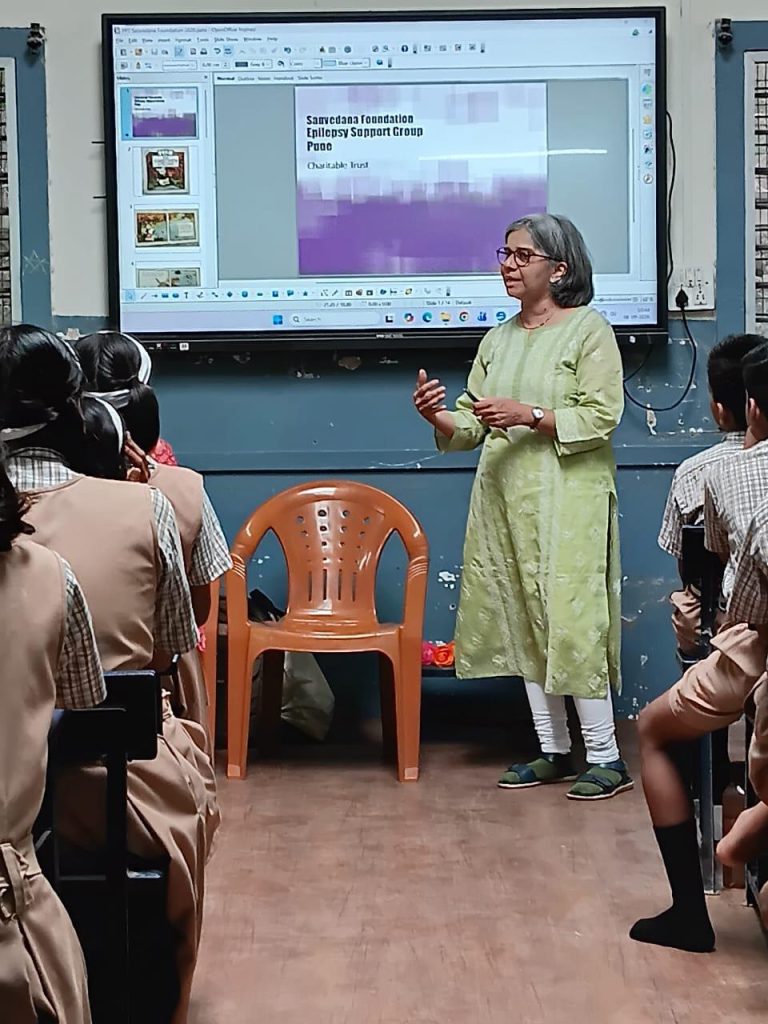 A speaker presenting Sanvedana information to students