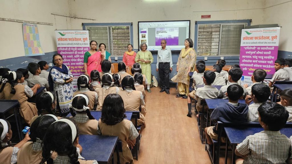 Sanvedana presenters speaking with students in a classroom