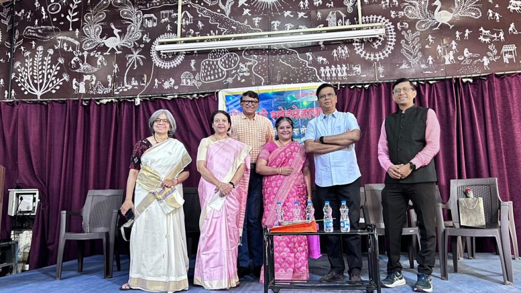 A group standing on stage at the matrimonial meet