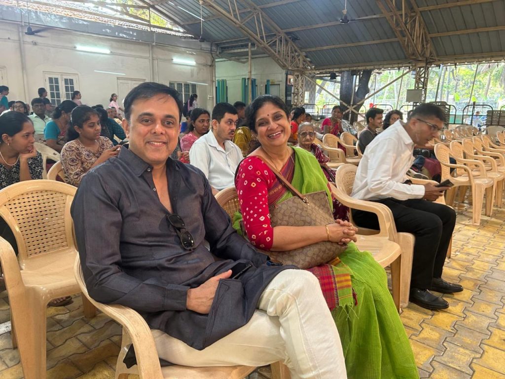 Attendees seated together in the meeting hall